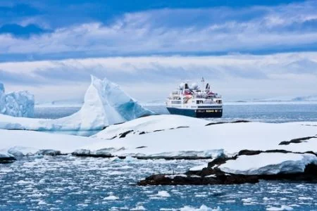 An expedition ship exploring a remote coastline